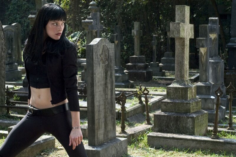 Woman in Black Outfit — Dramatic, Afternoon, Photograph, Gravestones