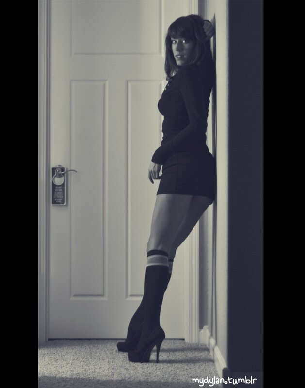 woman in black outfit leaning
