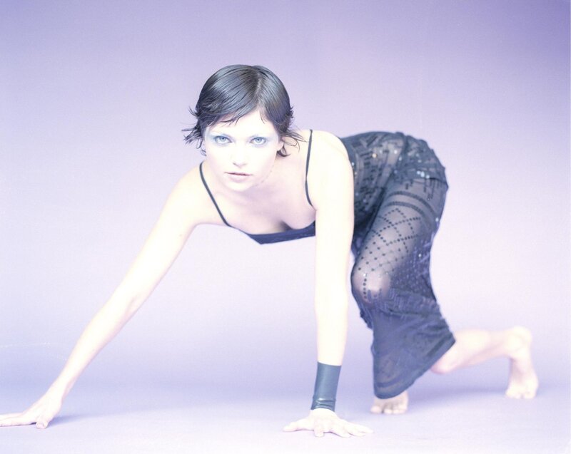 woman in black outfit on hands and knees