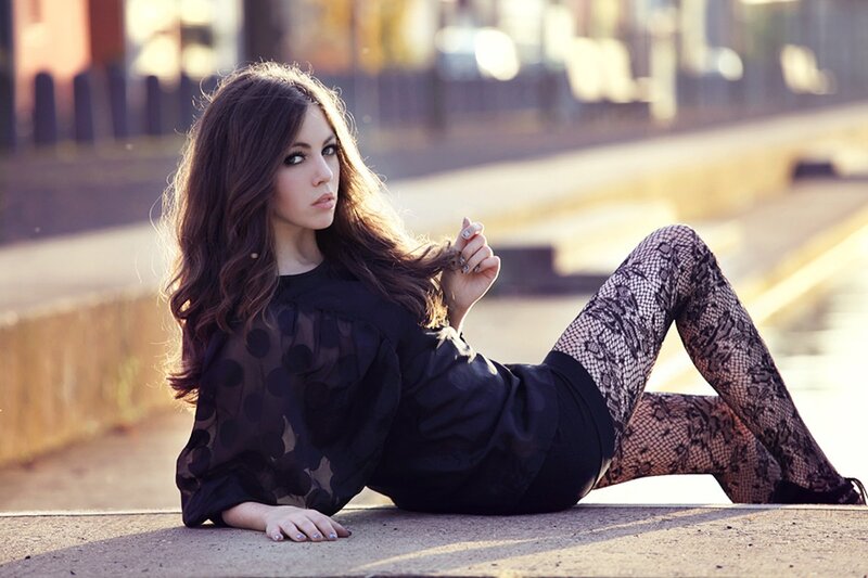 woman in black outfit on pavement