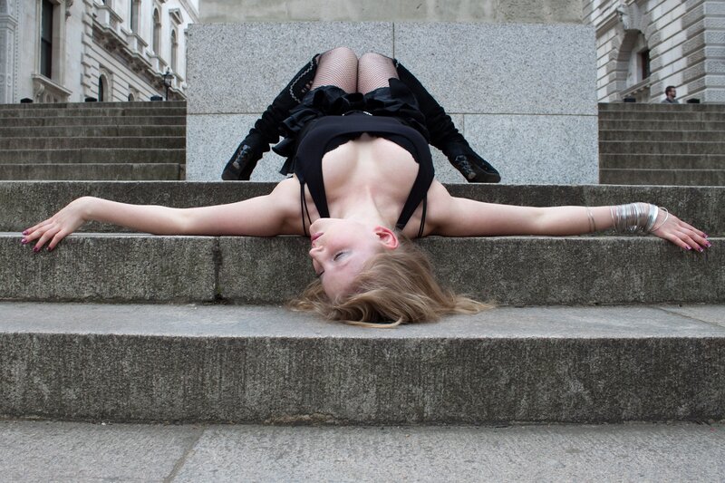 woman in black outfit on steps