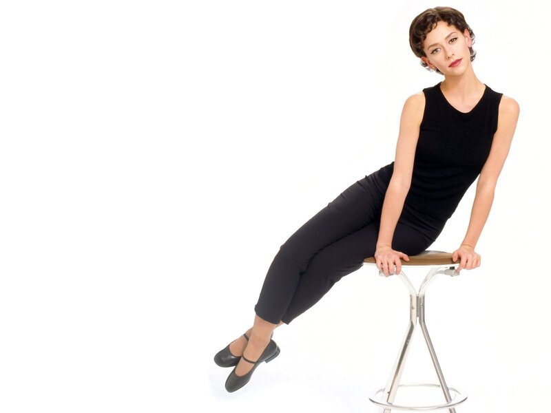 woman in black outfit on stool