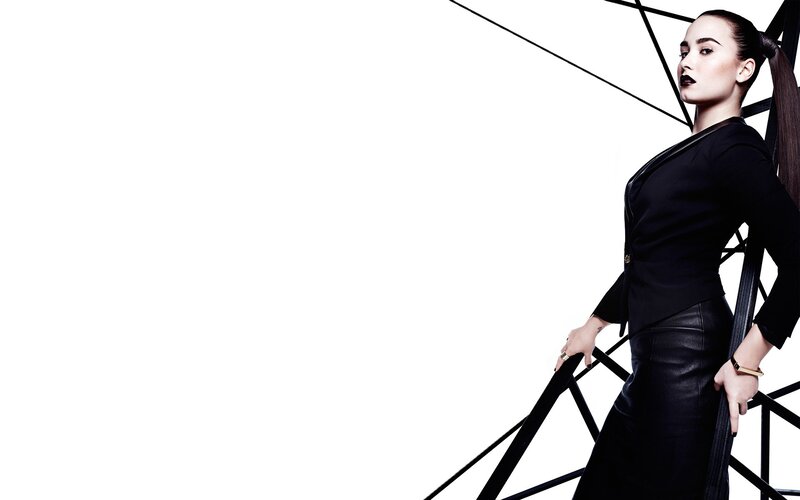 woman in black outfit on structure