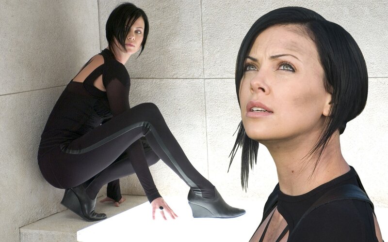 woman in black outfit posing