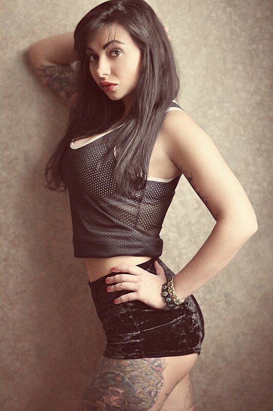 woman in black outfit posing