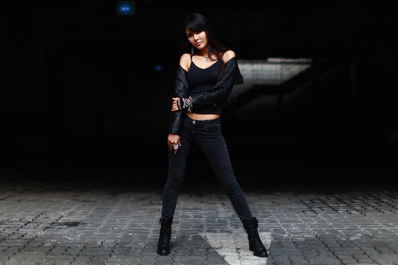 woman in black outfit posing