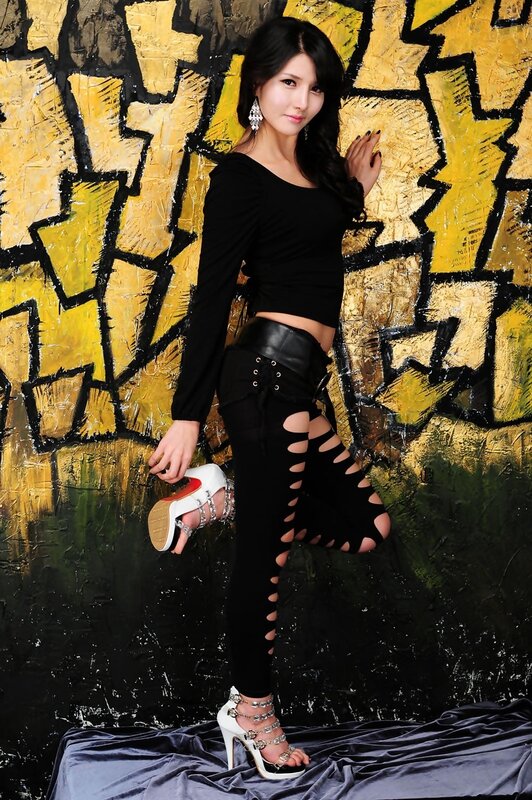 woman in black outfit posing