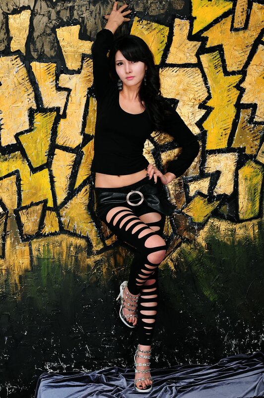 woman in black outfit posing