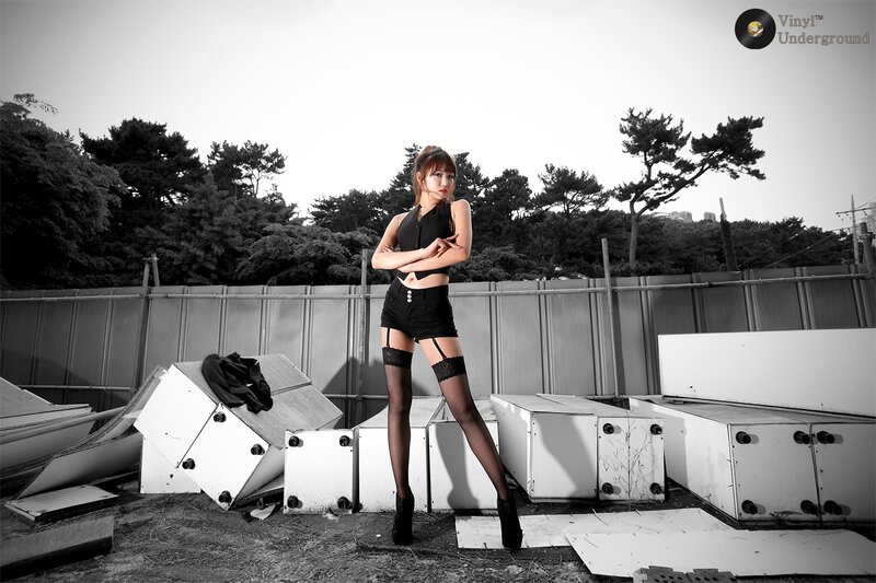 woman in black outfit posing