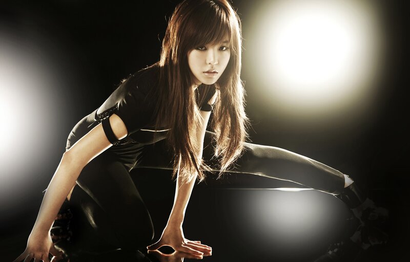 woman in black outfit posing