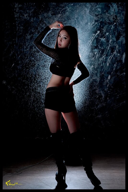 woman in black outfit posing
