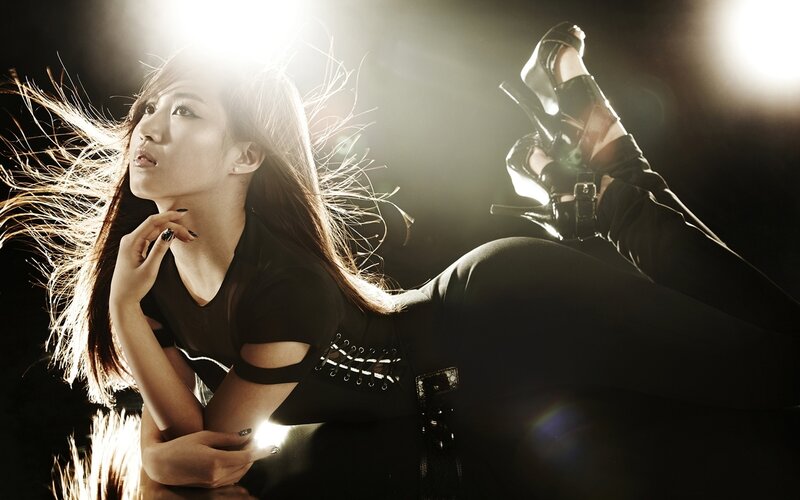 woman in black outfit posing