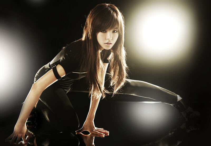 woman in black outfit posing