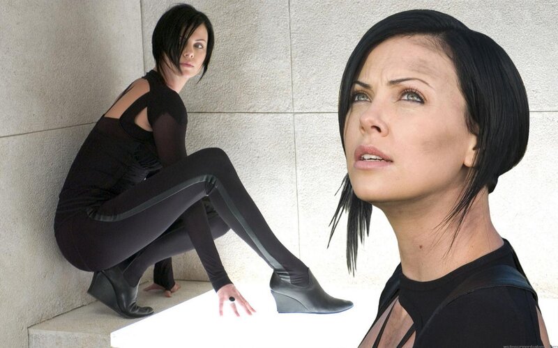 woman in black outfit posing