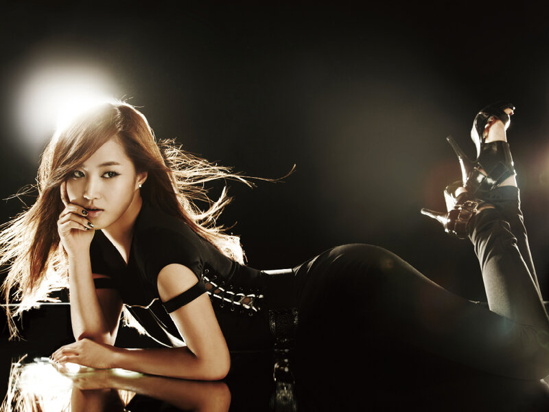 woman in black outfit posing