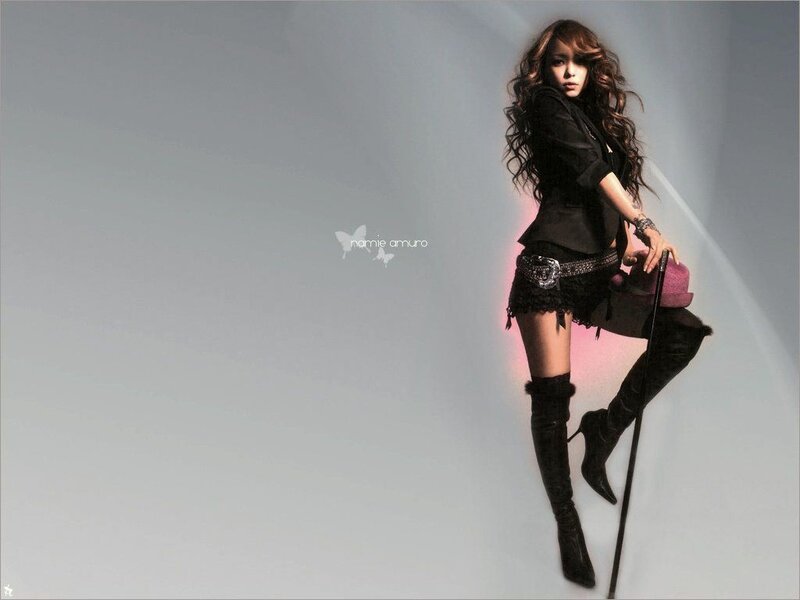 woman in black outfit posing