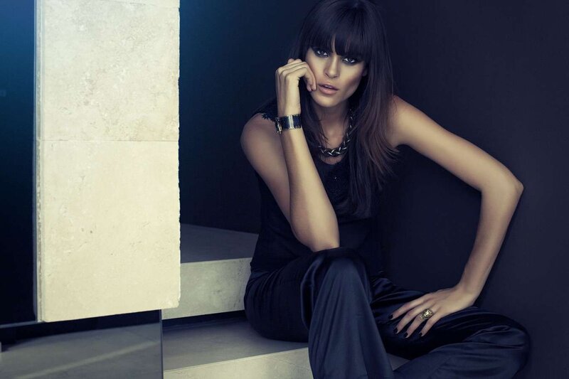 woman in black outfit sitting