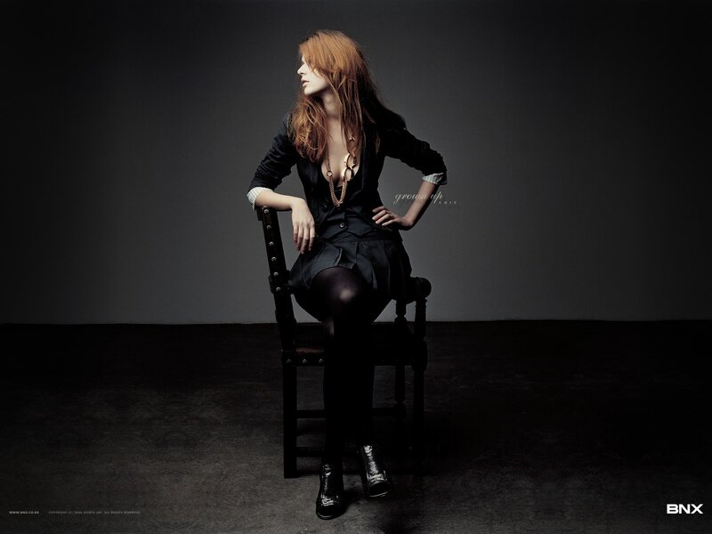 woman in black outfit sitting