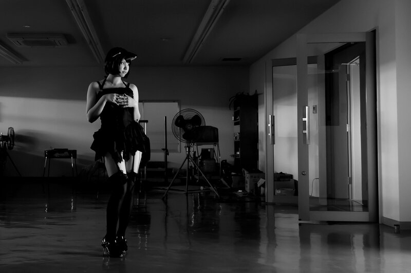woman in black outfit standing