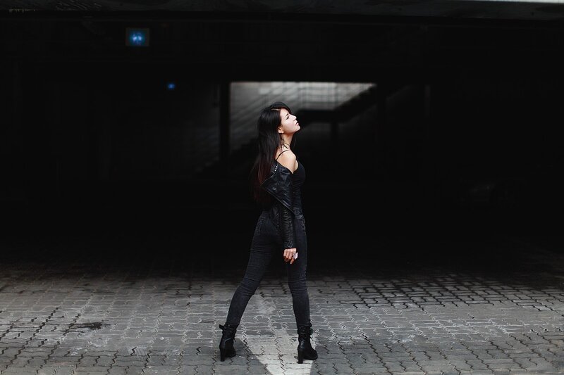 woman in black outfit standing