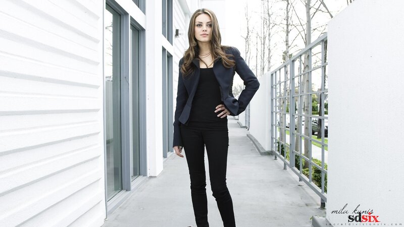 woman in black outfit standing outside