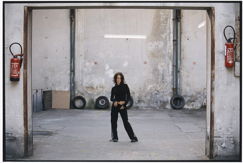 woman in black outfit standing