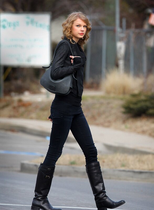 woman in black outfit walking