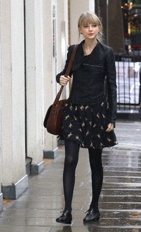 woman in black outfit walking
