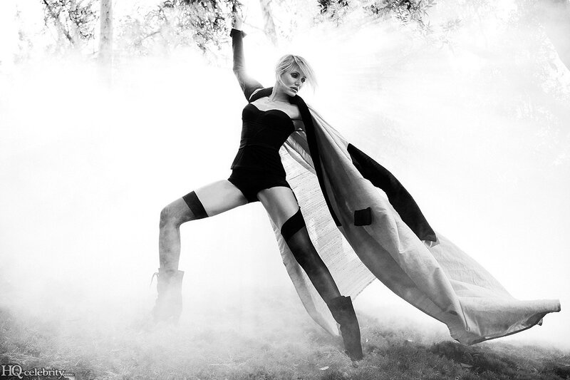 woman in black outfit with cape