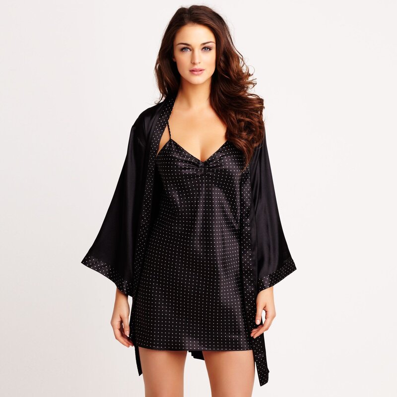 woman in black polka dot robe