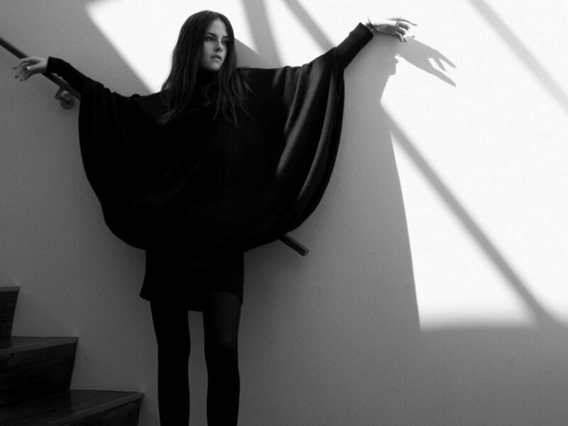 Woman in Black Poncho — Dramatic