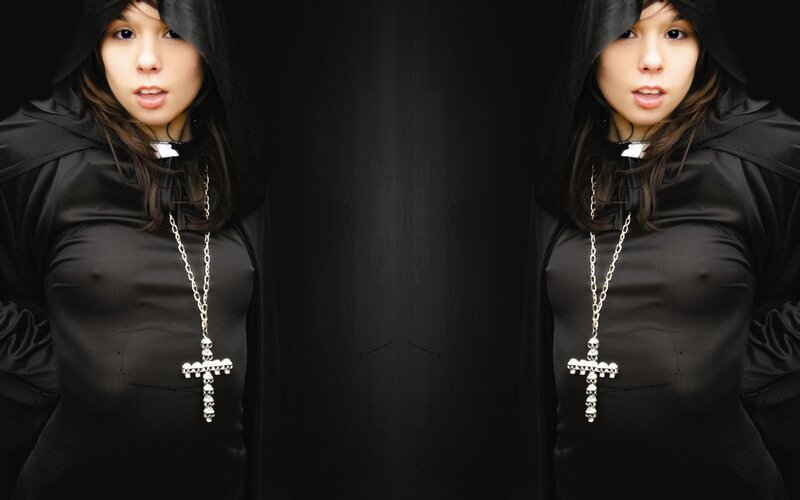 woman in black robe with cross