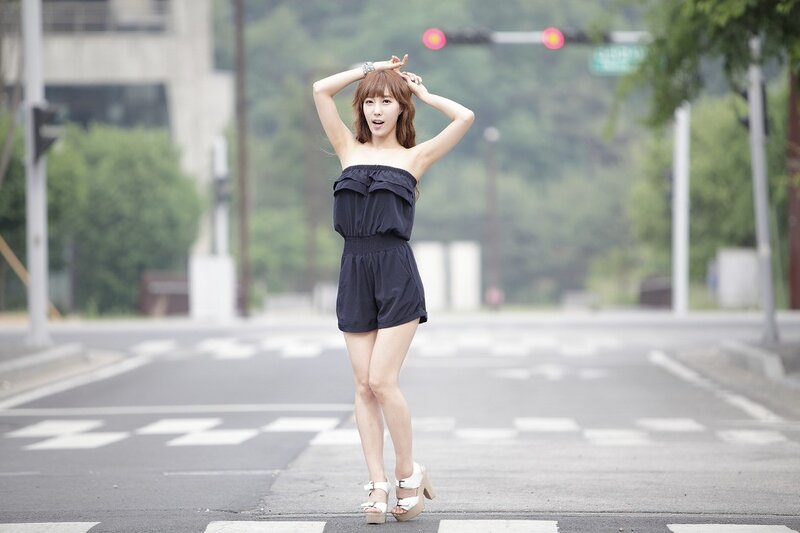 woman in black romper on street