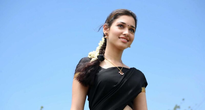 woman in black sari smiling