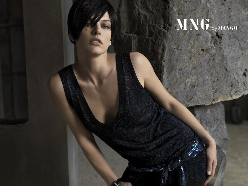 Woman in black sequined top