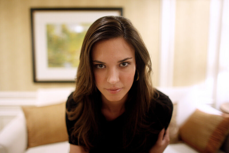 woman in black shirt looking at camera