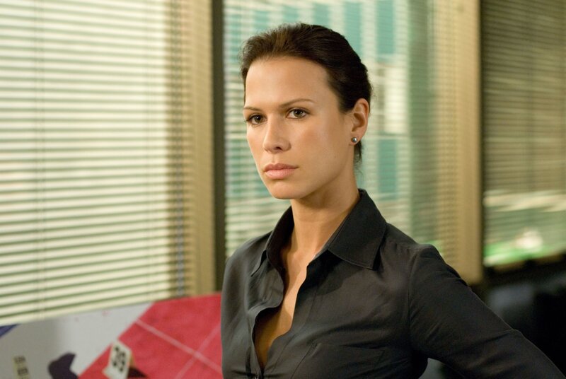 woman in black shirt looking serious