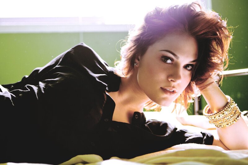 woman in black shirt lying down