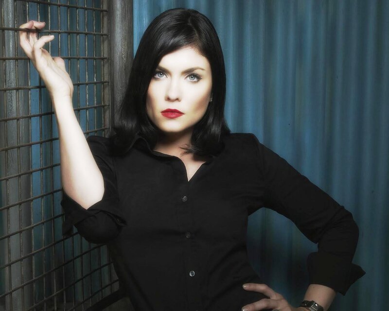 woman in black shirt posing