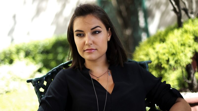 woman in black shirt sitting outside