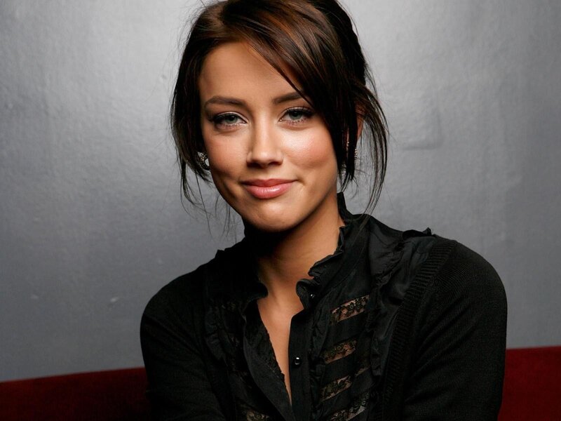 woman in black shirt smiling