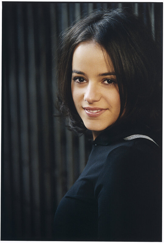 woman in black shirt smiling