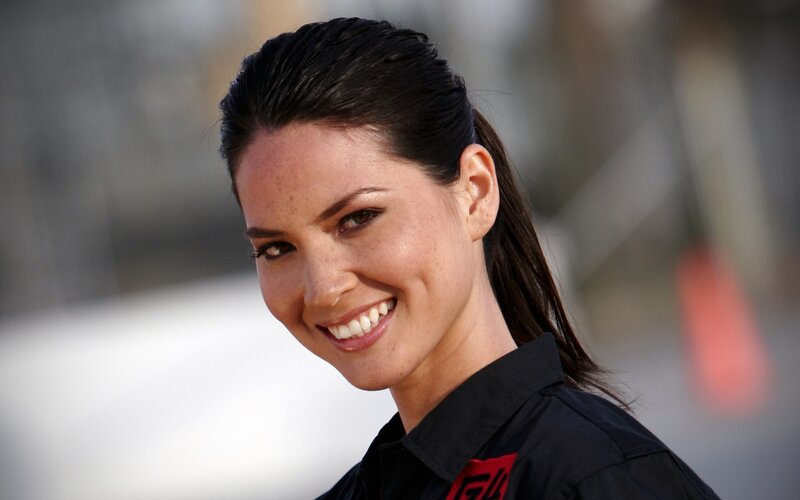 woman in black shirt smiling