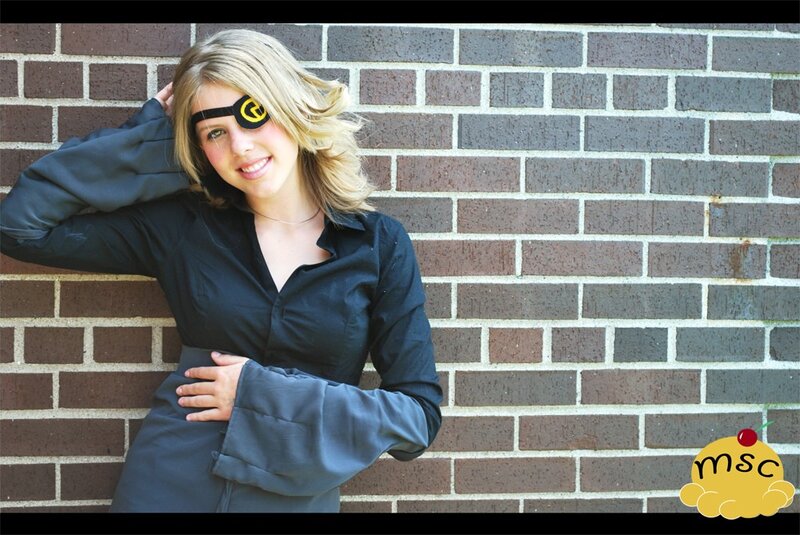 woman in black shirt with eye patch