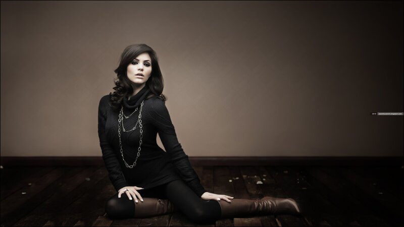 woman in black sitting on floor