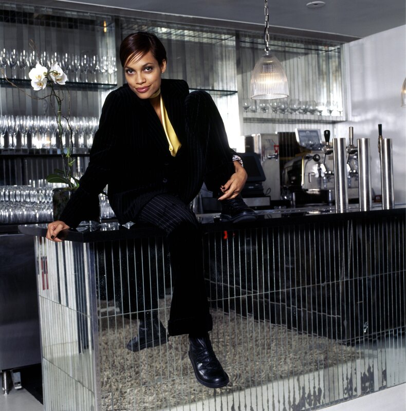 woman in black suit at bar