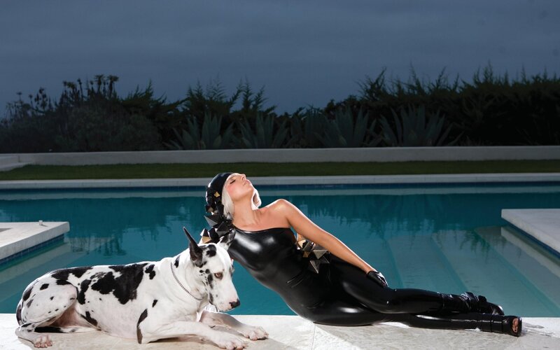 Woman in black suit by pool