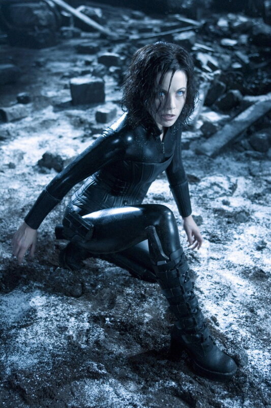 woman in black suit crouching