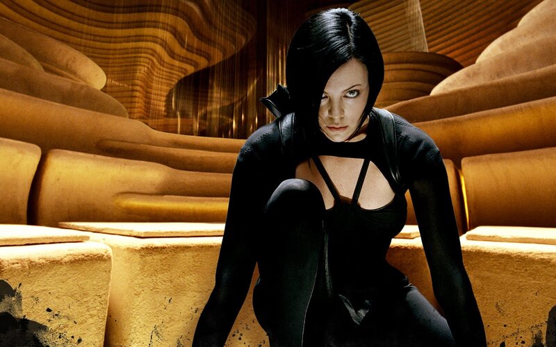Woman in black suit crouching