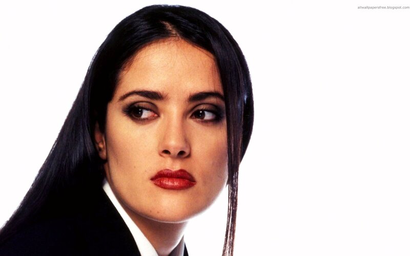 woman in black suit looking away